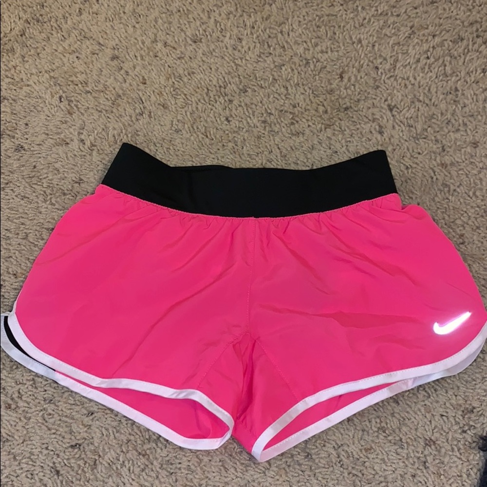 Pink and black Nike running shorts